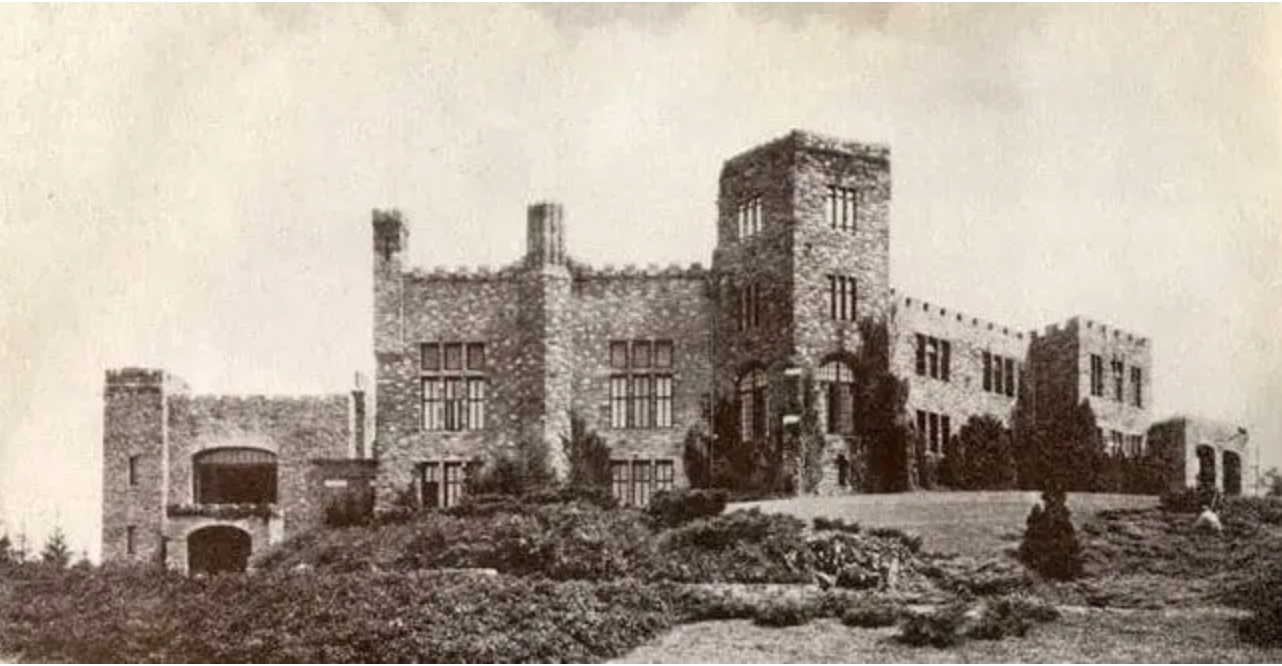 Seely castle, also known as Overlook Mansion, is a 20,000-square-foot English Gothic-style castle, seen here in a sepia-tone photo.