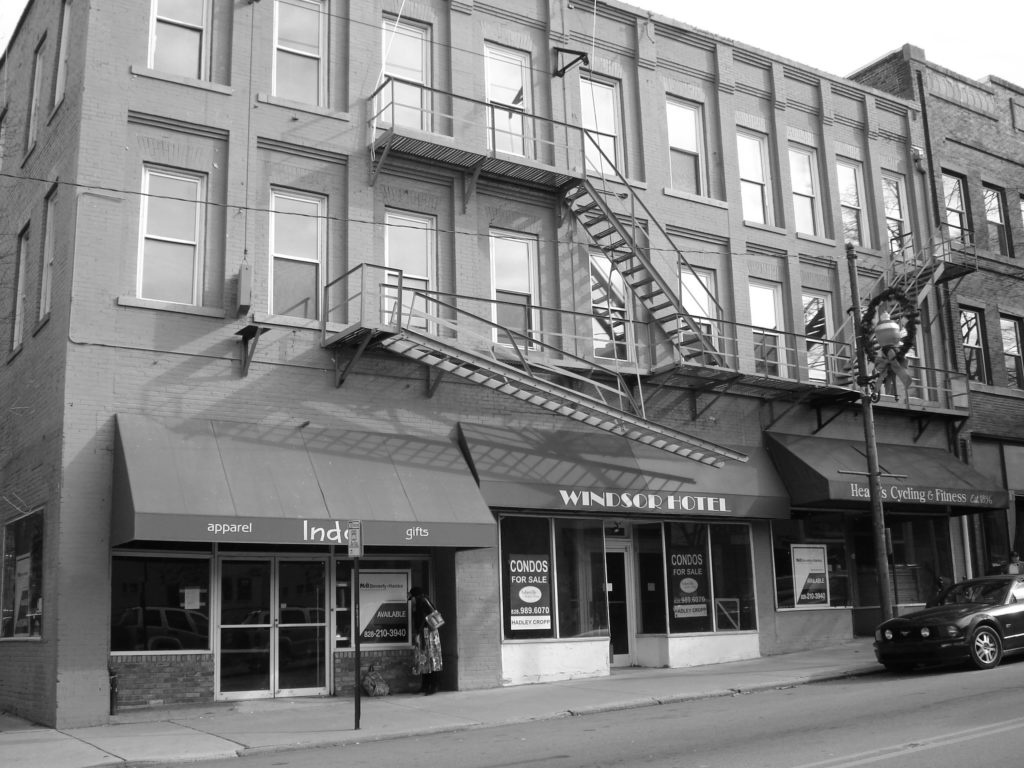 A black and white photo of the Windsor Hotel as a residential hotel.