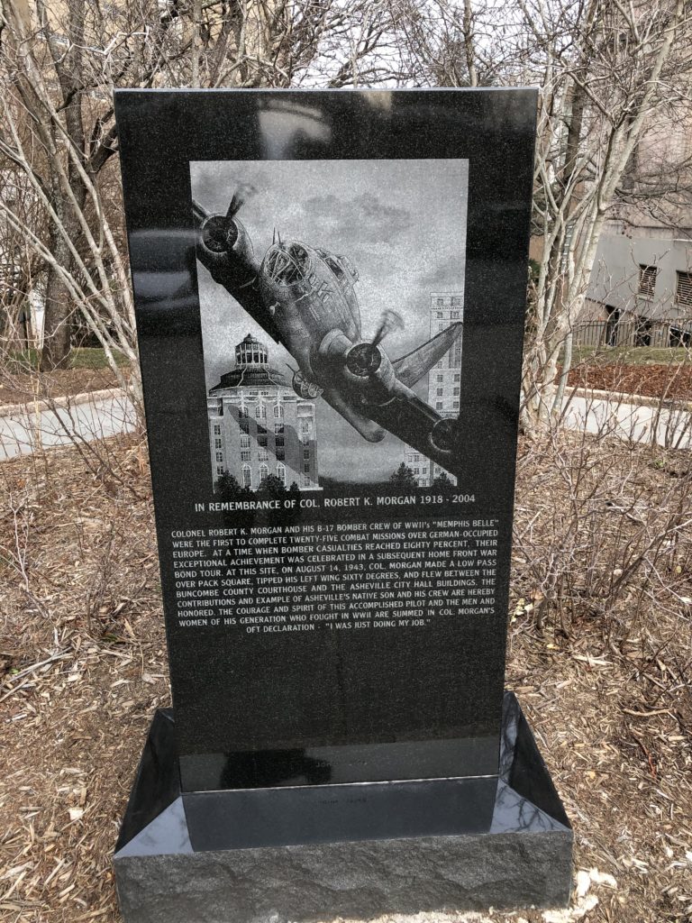Monument set between the Asheville City Hall and Buncombe County Courthouse, where Robert Morgan flew the Memphis Belle between the buildings